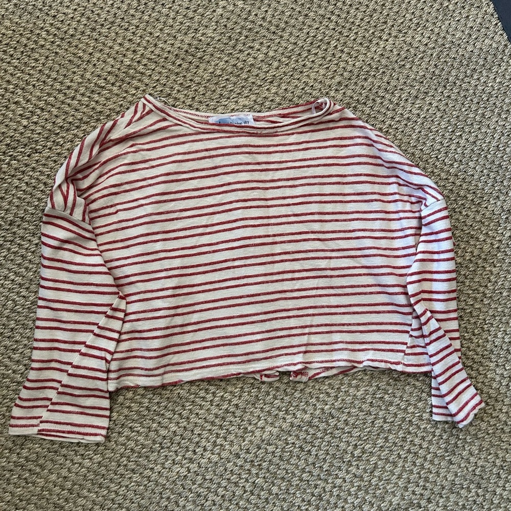 Crop blouse, cover up, or light pullover sweater.